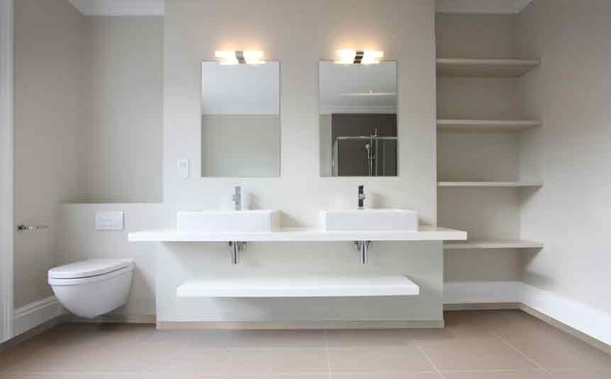 Floating shelves above toilet
