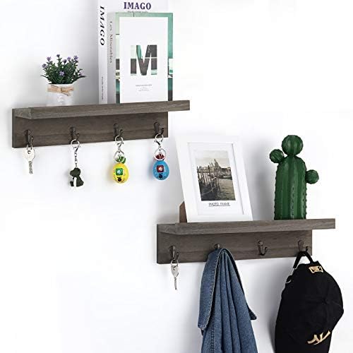 Vertical wall hooks and floating shelves for organizing small apartment spaces