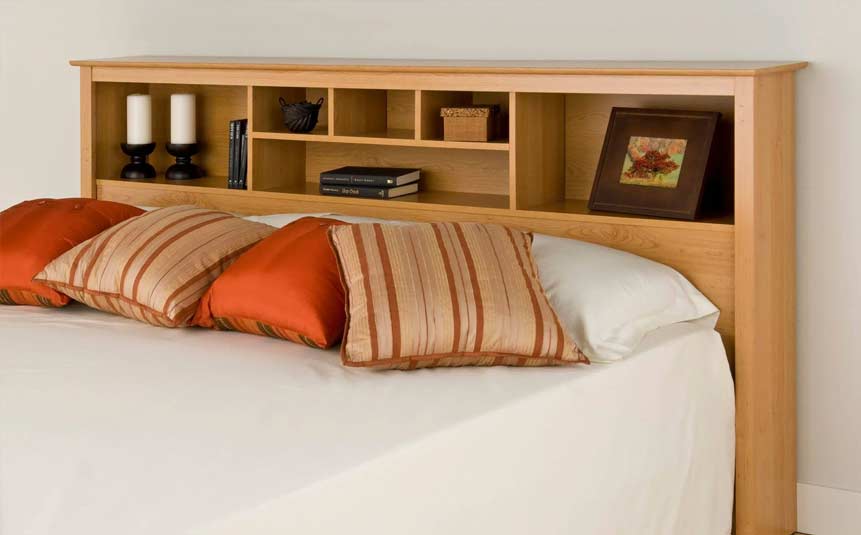 Bed with headboard featuring built-in shelves