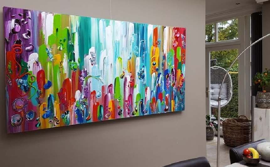 Large abstract DIY painted canvas art on a living room wall