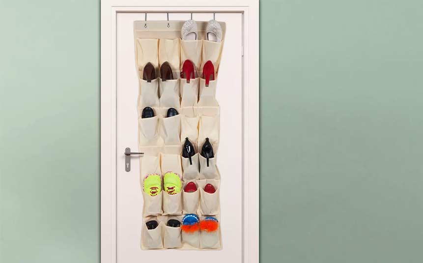 Over-the-door shoe organizer hanging on a white door