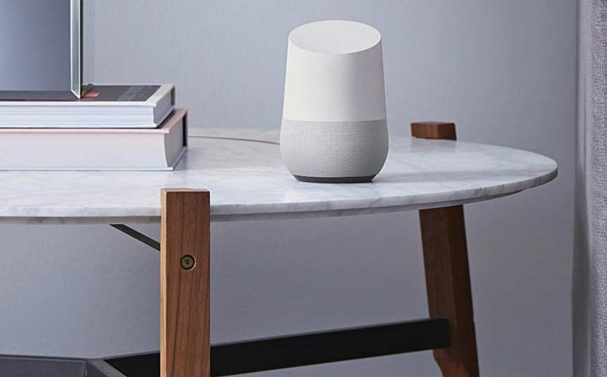 Smart speaker placed on a wooden table in a living room