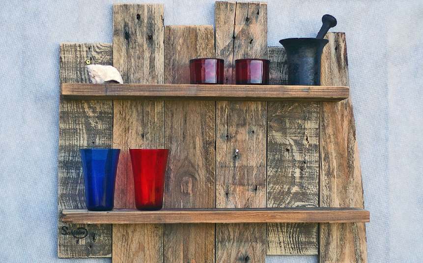 Upcycled wall art made from reclaimed wood and old jars